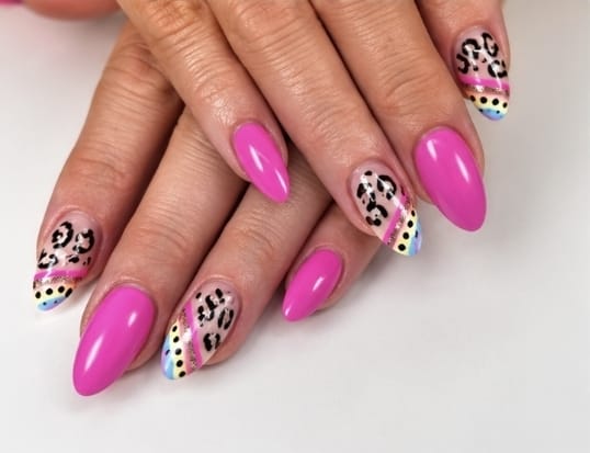 Manicured nails in pink with leopard print and glitter detail, shared by Aesthetics by D