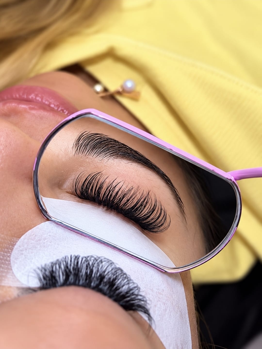 Close-up of a client's eyelash extensions and eyebrow styling, shared by Aesthetics by D